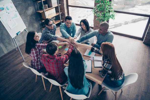 istock Above high angle view of nice stylish attractive beautiful handsome cheerful executive managers wearing casual sitting at industrial loft interior style workplace workstation open space indoors 1142840504