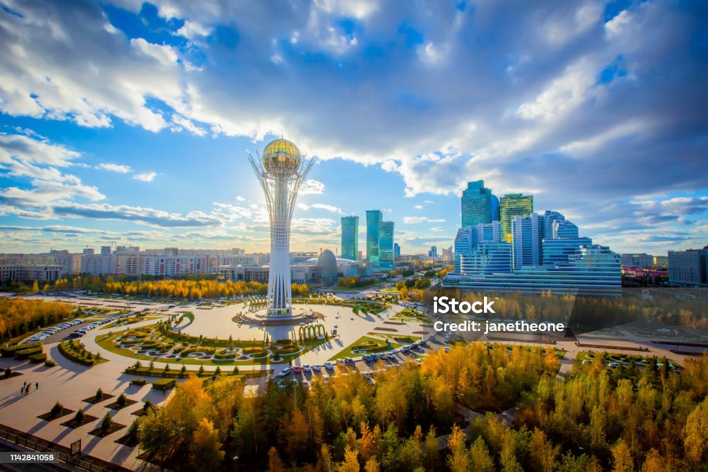 Astana, Nur-Sultan, Kazakhstan. Center of the city, skyscraper, view on Baiterek Golden autumn in the capital of Kazakhstan. Modern buildings and blue sky. Kazakhstan Stock Photo