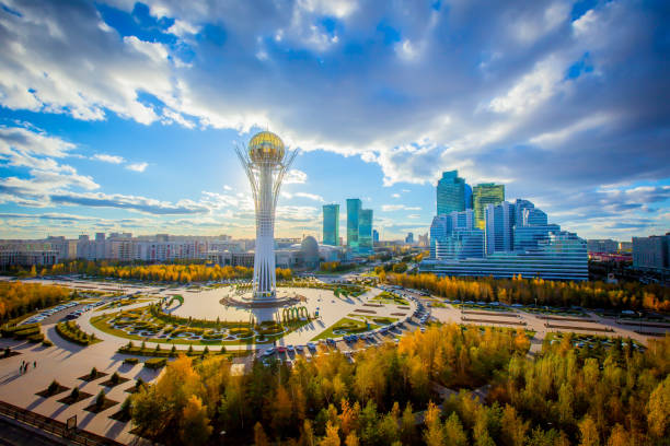 Astana, Nur-Sultan, Kazakhstan. Center of the city, skyscraper, view on Baiterek Golden autumn in the capital of Kazakhstan. Modern buildings and blue sky. kazakhstan photos stock pictures, royalty-free photos & images