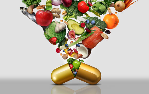 Vitamin Dietary Supplement Vitamin dietary supplement as a capsule with fruit vegetables nuts and beans inside a nutrient pill as a natural medicine health treatment with 3D illustration elements. vitamin photos stock pictures, royalty-free photos & images