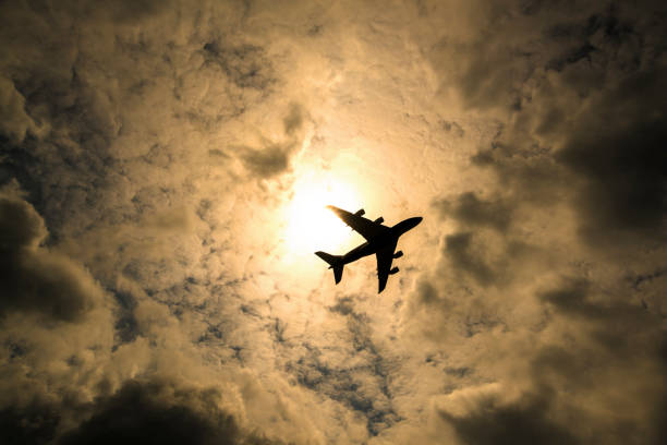 istock The big airplane fly passing the sun 1142842758