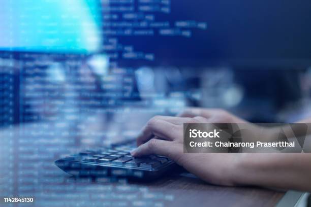 Close Up Programmer Man Hand Typing On Keyboard At Computer Desktop For Input Coding Language To Software For Fix Bug And Defect Of System In Operation Room Technology Concept Stock Photo - Download Image Now
