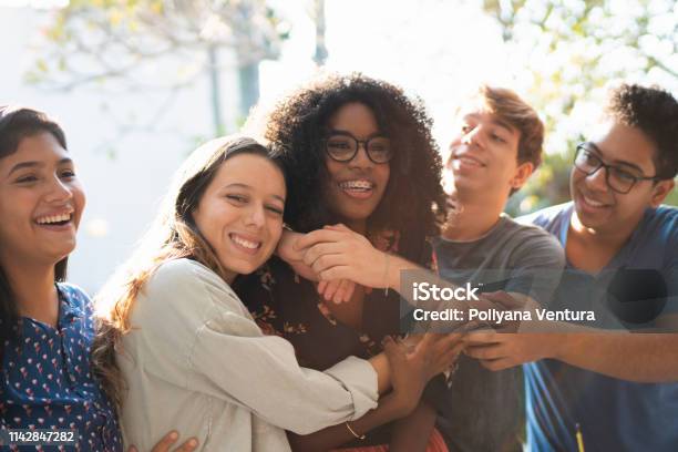 An Affectionate Hug Of Birthday Stock Photo - Download Image Now - Teenagers Only, Teenager, Friendship