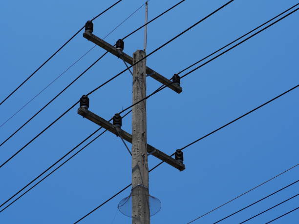 istock Electricity wire and pole with blue sky 1142847910