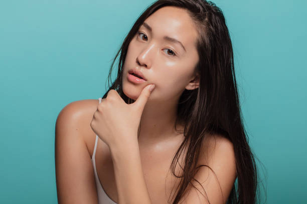 istock Asian woman with glowing skin 1142851021