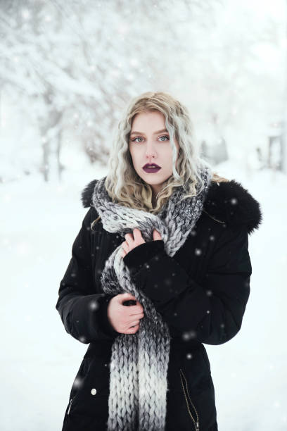 istock Beautiful woman on snow 1142851605