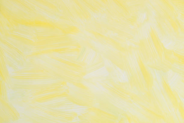 istock yellow painted on paper background texture 1142855360