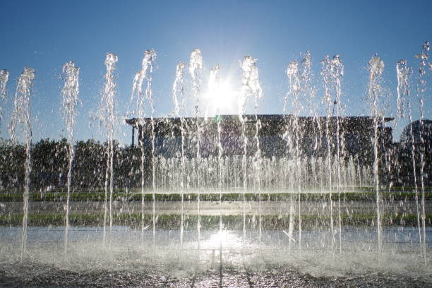 istock sunbeams behind the fountain 1142855541