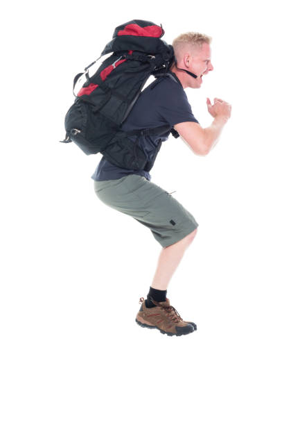 istock Attractive young male hiker running and jumping 1142855888