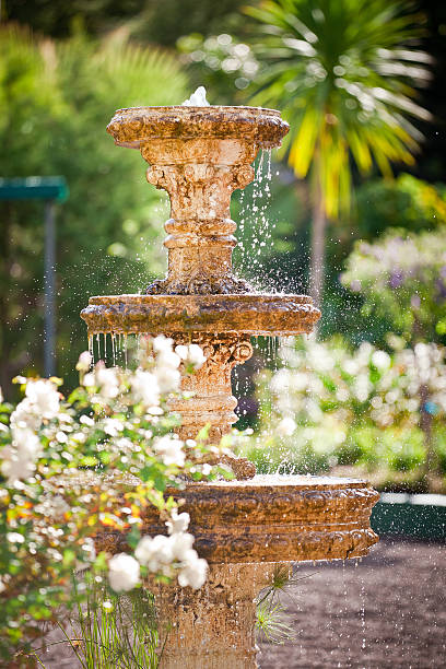 istock Bubbling fountain in courtyard garden 114285680