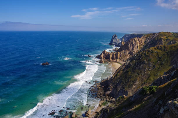 istock Atlantic ocean coastline view from Cabo da Roca (Cape Roca) is a cape which forms the westernmost extent of mainland Portugal and continental Europe. Portugal 1142856944