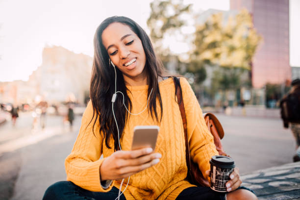 istock Woman text messaging on the street 1142857395
