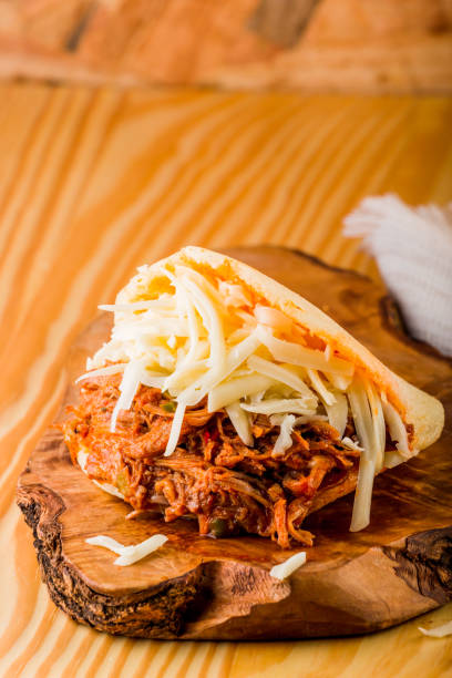 istock Roasted beef arepa on a wooden table 1142857496