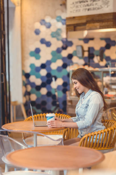 istock Attractive woman with a laptop 1142858589