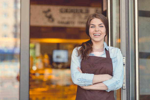 istock Smiling woman in the bakery 1142858604
