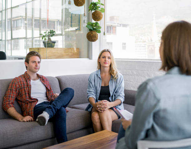istock Young couple visiting real estate agent in office 1142858971