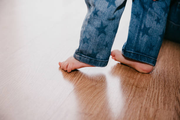 istock Baby walking on bare feet 1142859041