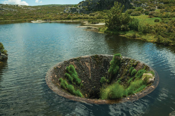 istock Large sinkhole in a dam lake on the highlands 1142859868