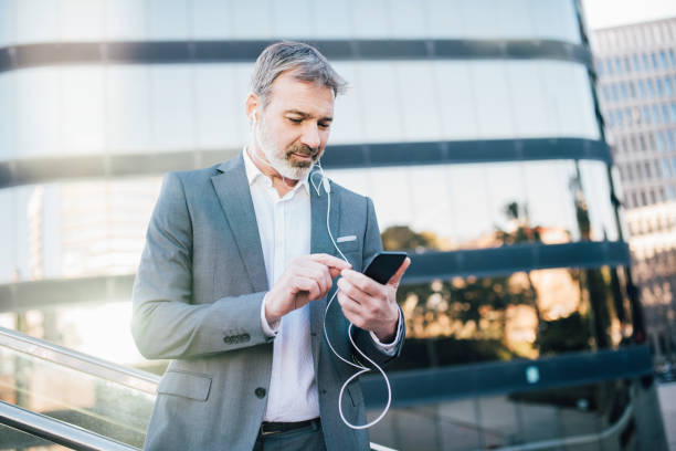Man listening podcast via mobile phone