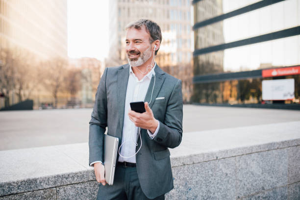 istock Man listening music with mobile phone 1142860791