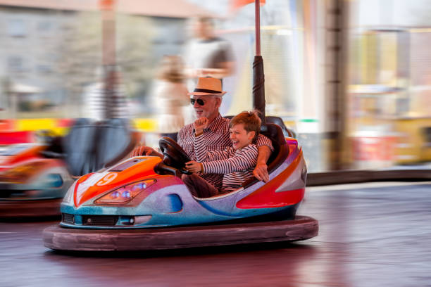 istock Family in bumper car 1142861640