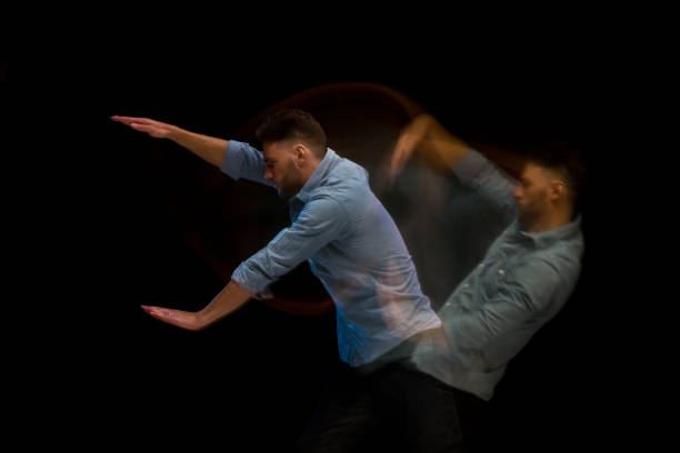 istock Handsome man in a blue shirt dancing 1142865272
