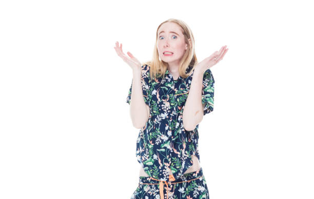 istock Attractive white female in pajamas - confusion 1142865489