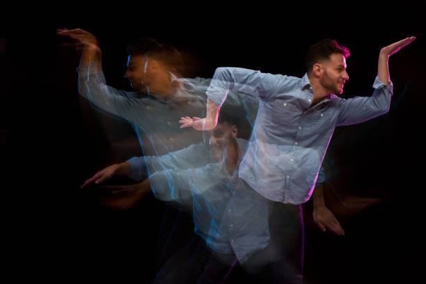 istock Handsome man in a blue shirt dancing 1142865530