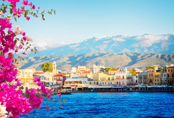 venetian habour of Chania, Crete, Greece famouse venetian bay of Chania at sunny day with flowers, Crete Greece, toned crete stock pictures, royalty-free photos & images