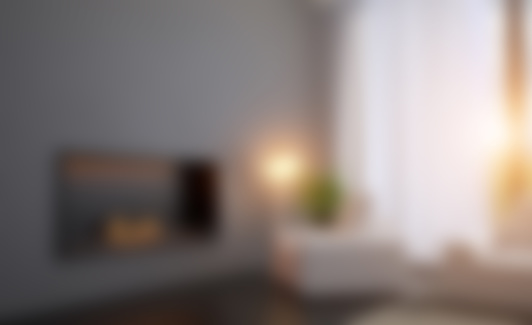 View of the chair near the fireplace. Living room with a large window.. 3D rendering. Sunset. Unfocused