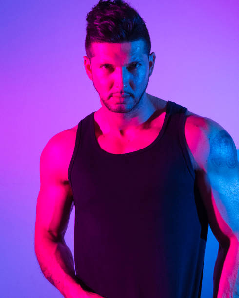 istock Handsome latino man in front of colorful wall 1142866375
