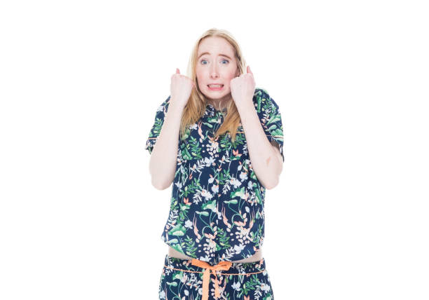 istock Attractive white female in pajamas - shock 1142866444