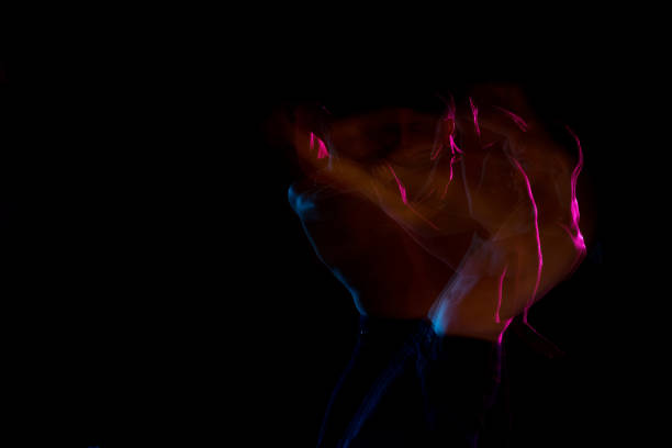 istock Shirtless man dancing with color gel lights 1142866446