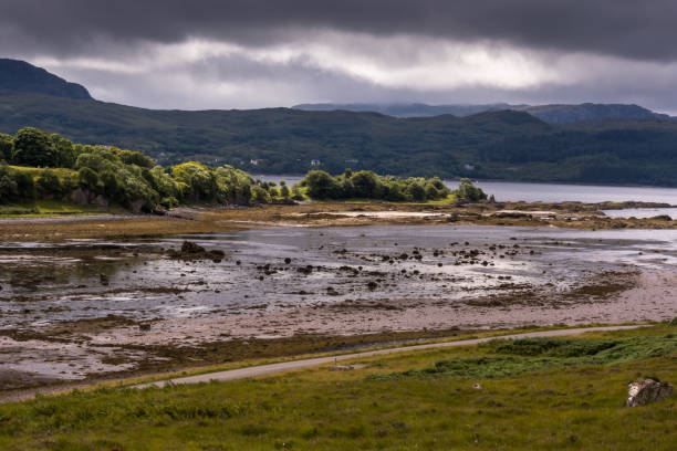 Typical landscape on the Gaelic peninsula Applecross Typical landscape with coast and pastures on the Gaelic peninsula Applecross, Strathcarron, Inner Hebrides, Scotland, UK applecross peninsula stock pictures, royalty-free photos & images