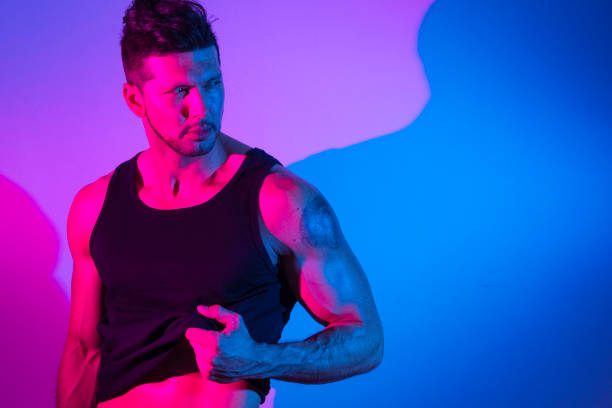 istock Handsome latino man in front of colorful wall 1142866628