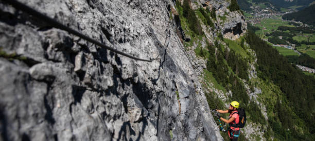 istock Pretty, female climber on a via ferrata 1142866766