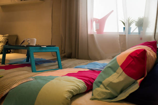 istock Beautiful bed, table for eating. Breakfast. Against the window 1142867077
