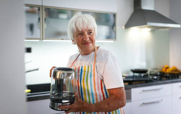 istock Senior woman cooking in the kitchen 1142867094