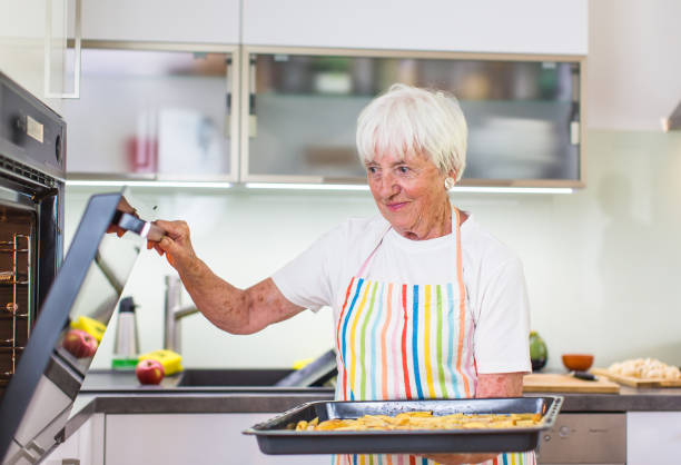istock Senior woman cooking in the kitchen 1142867184
