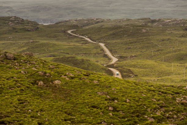 Typical landscape on the Gaelic peninsula Applecross Typical landscape with street and pastures on the Gaelic peninsula Applecross, Strathcarron, Inner Hebrides, Scotland, UK applecross peninsula stock pictures, royalty-free photos & images