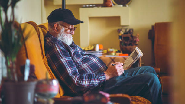 istock Senior with crossword 1142870623
