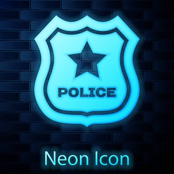 istock Glowing neon Police badge icon isolated on brick wall background. Sheriff badge sign. Vector Illustration 1142870794