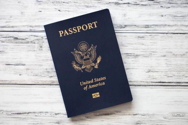 istock American passport with biometric chip on woddenbackground, top view 1142871299