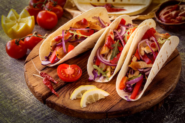 istock tacos with chicken, pepper, tomatoes, cabbage and salsa 1142872406