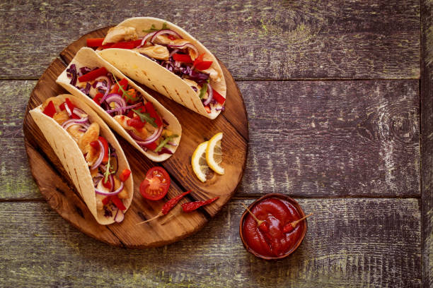 istock tacos with chicken, pepper, tomatoes, cabbage and salsa 1142872451