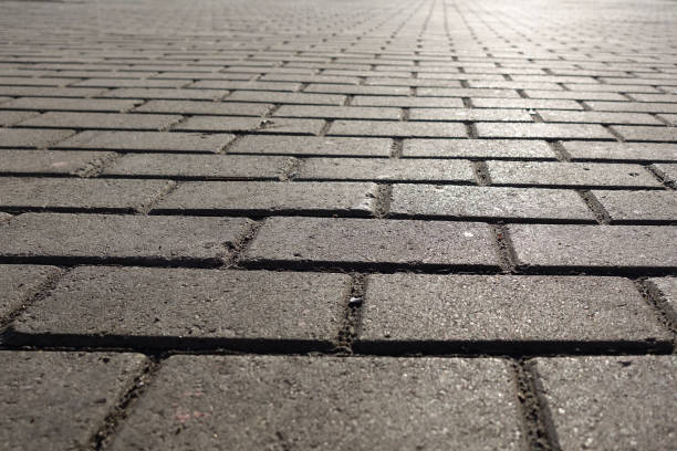 istock A part of footpath. Street tiled stone pavement. Background for design pattern artwork. 1142874118