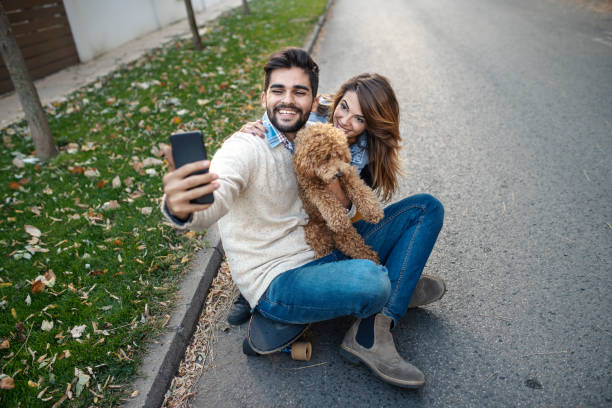 istock Young skaters posing and taking a selfie with mobile 1142876528