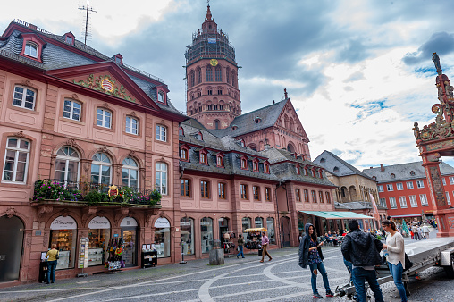 Mainz, Germany - September 2, 2014: Tourists are enjoying the street View at Mainz, Germany. The outside wall of building with local cultural decor.