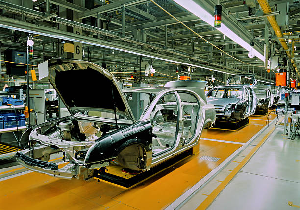 car production line unfinished automobiles in a car plant production line stock pictures, royalty-free photos & images