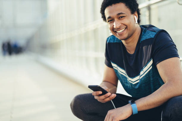 istock Male athlete with smart phone 1142888141